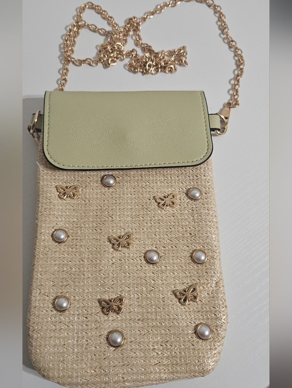 Straw Crossbody Bag with Pale Green Flap and Gold Accents